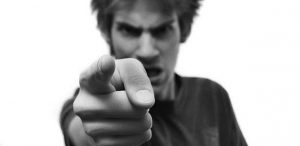 angry aggressive teen pointing finger illustrating Bible story of the rebellious child